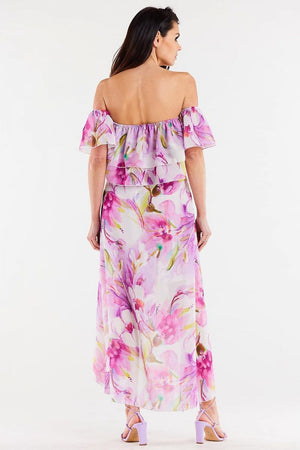 Jupe longue fluide rose à motifs floraux, idéale pour un look bohème et féminin, tendance pour l'été.