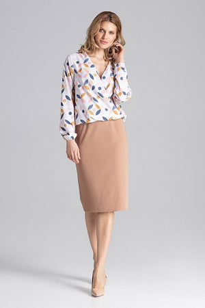 Jupe crayon beige midi élégante pour un look professionnel chic et féminin, idéale pour le bureau ou les événements formels.