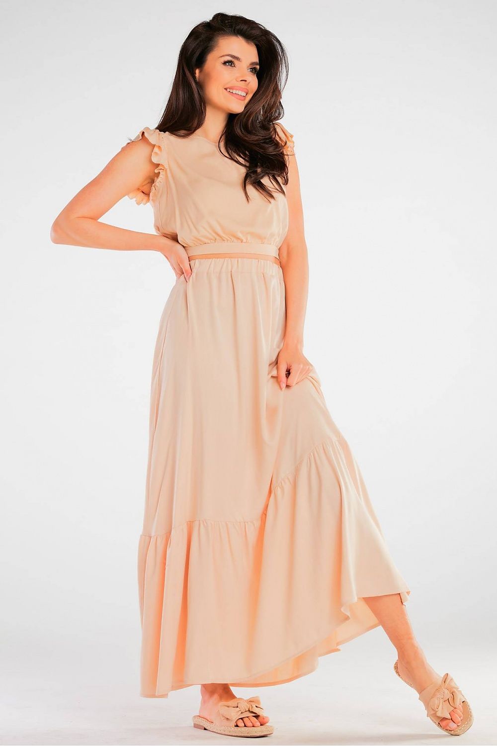 Jupe longue fluide beige, coupe élégante et confortable pour une allure chic et décontractée.