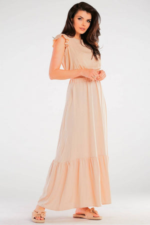 Jupe longue fluide beige pour un look élégant et décontracté, parfaite pour une tenue estivale ou une occasion spéciale.