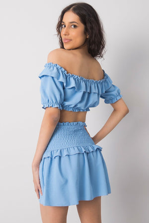 Jupe courte bleue plissée à taille élastiquée, parfaite pour un look estival décontracté et tendance.